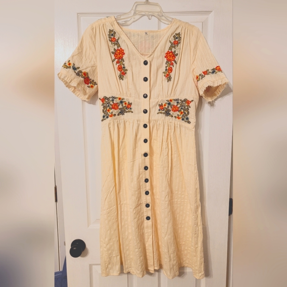 Beautiful embroidered cream midi-dress. Brand new without tags. Never worn.